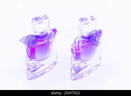 Beautiful perfume bottles on the white background Stock Photo