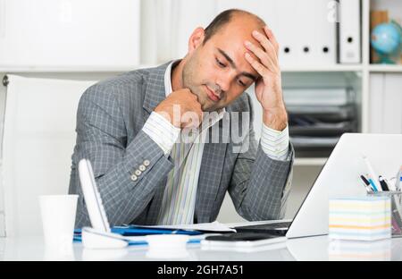 Male having lot of work and problems Stock Photo