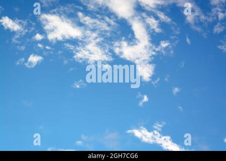 Horizontal view with white small clouds against blue sky Stock Photo