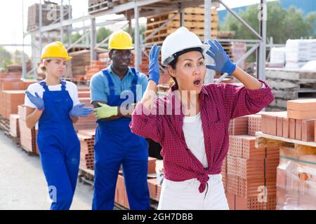 Taskmaster amazed by something in outdoor warehouse Stock Photo