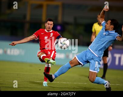 SAN MARINO, SAN MARINO - SEPTEMBER 05: Robert Lewandowski of Poland competes for the ball with Cristian Brolli of San Marino ,during the 2022 FIFA World Cup Qualifier match between San Marino and Poland at San Marino Stadium on September 5, 2021 in San Marino, .(Photo by MB Media) Stock Photo