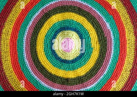 handmade round multicolor cotton knitted rug, top view, directly above Stock Photo