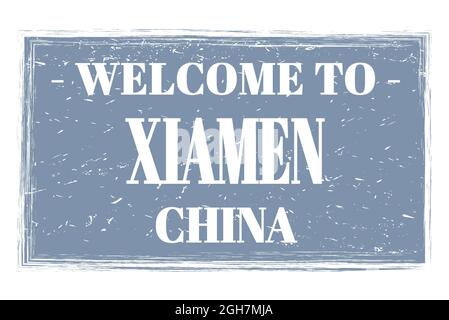 WELCOME TO XIAMEN - CHINA, words written on gray rectangle post stamp Stock Photo