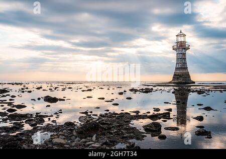 Whiteford Point Lighthouse near Whiteford Sands at sunset, the Gower peninsula, Swansea, South Wales, the United Kingdom Stock Photo