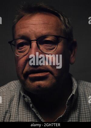 head and shoulder portrait of middle aged man wearing glasses Stock Photo