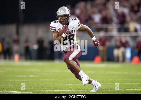 Montana Grizzlies running back Isiah Childs (28) runs with the ball during the fourth quarter of an NCAA college football game against the Washington Stock Photo