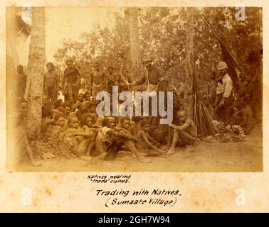 Europeans trading with the natives of Sumaate Village in Papua New Guinea during the G.S.A. (Geographical Society of Australasia) New Guinea Exploring Expedition 1885 Stock Photo
