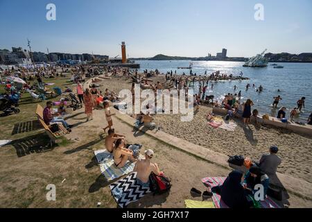 People enjoying the beach on a hot summer day in Oslo, Norway, Europe