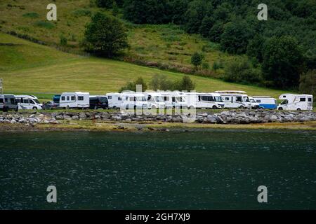 Motorhomes parked by the water at Geiranger fjord, Norway, Europe Stock Photo