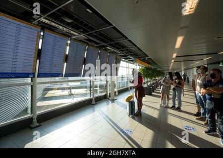 Passengers looking at schedule boards at Schiphol Airport in Amsterdam, The Netherlands, Europe Stock Photo