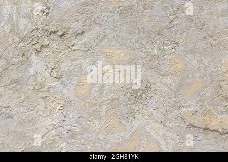 Closeup shot of a texture on a stained uneven wall Stock Photo