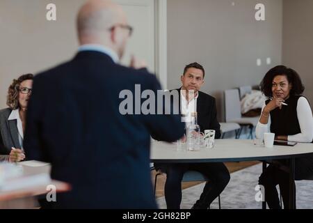 Business people brainstorming during meeting at education class Stock Photo