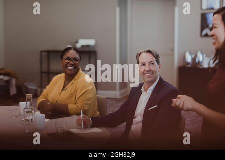 Smiling male and female business professionals in meeting at education class Stock Photo