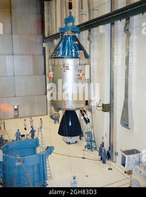 (31 Jan. 1969) --- Interior view of the Kennedy Space Center's Manned Spacecraft Operations Building showing Apollo Spacecraft 106/Command/Service Module being moved to integrated work stand number one for mating to Spacecraft Lunar Module Adapter (SLA) 13. Spacecraft 106 will be flown on the Apollo 10 (Lunar Module 4/Saturn 505) space mission Stock Photo