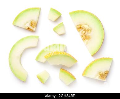 Galia melon pieces isolated on white background. View from above, flat lay Stock Photo