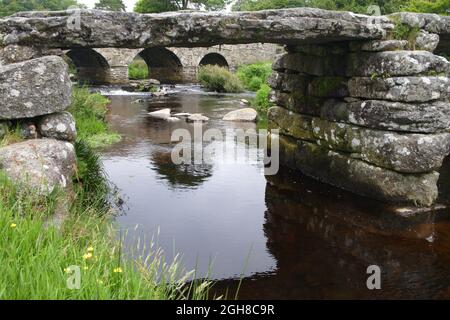 the ancient clapper bridge at post bridge on dartmoor devon Stock Photo