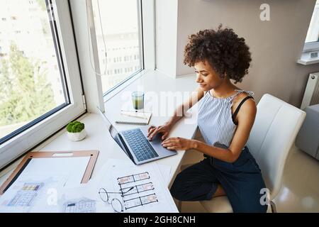 African American female architect working from home Stock Photo