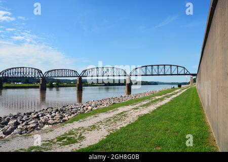 The railroad bridge and Ohio River flood wall in the small town of Point Pleasant West Virginia Stock Photo