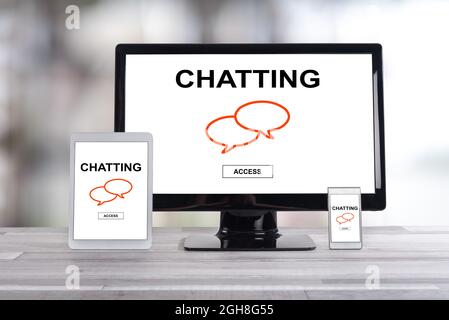 Chatting concept shown on different information technology devices Stock Photo
