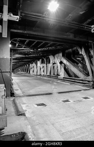 Empty vintage urban street and underground steel bridge Stock Photo