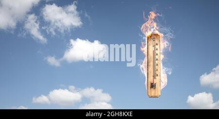 Thermometer on fire - Global warming concept Stock Photo