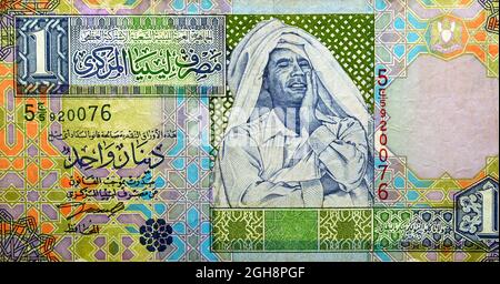 Large fragment of the obverse side of 1 one Libyan dinar banknote currency issued 2002 by the central bank of Libya with Muammar al-Ghaddafi image, vi Stock Photo