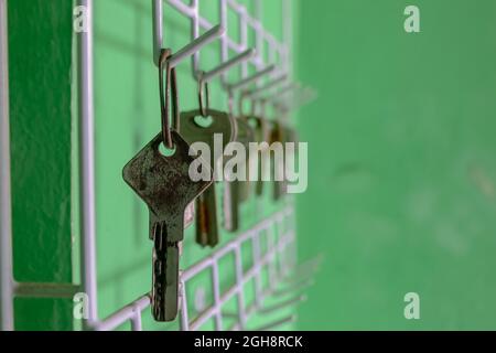Locks lined up hanging on the wall Stock Photo