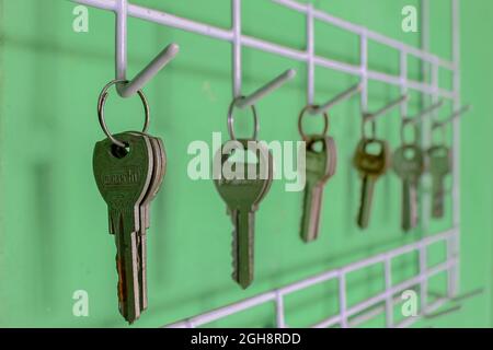 Locks lined up hanging on the wall Stock Photo