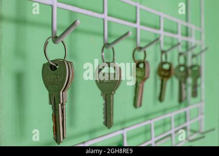 Locks lined up hanging on the wall Stock Photo