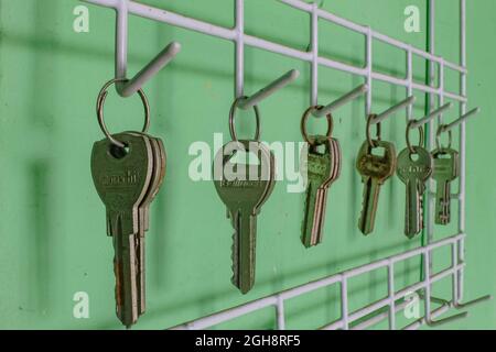 Locks lined up hanging on the wall Stock Photo
