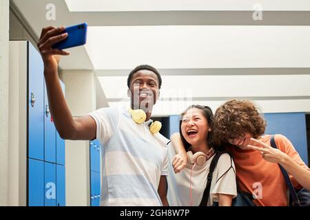 Multi-ethnic group of students taking a selfie at the college. Stock Photo