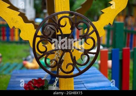 Spindle wheel. Metal circle. Round wrought iron. Well handle. The handle is rotary. Russian metal forging. Stock Photo