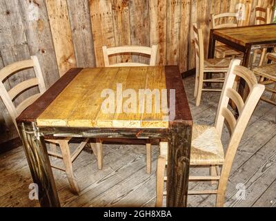 an industrial-style iron and wood table seen from above Stock Photo
