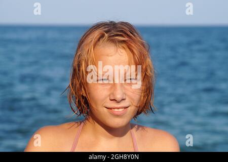 smilling teenage girl on the background of the sea horizon, portrait Stock Photo