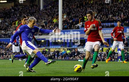 Phil Neville of Everton shoots at goal during the Barclays Premier League between Everton and Swansea City at the Goodison Park in Liverpool, England on January 12, 2013. Paul Thomas Stock Photo