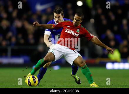 Seamus Coleman of Everton in action with Wayne Routledge of Swansea City during the Barclays Premier League between Everton and Swansea City at the Goodison Park in Liverpool, England on January 12, 2013. Paul Thomas Stock Photo