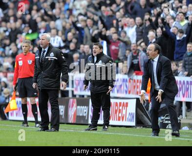 Newcastle United manager Alan Pardew (L) and assistant John Carver protest to referee Howard Webb after Jonas Gutierrez of Newcastle United is fouled by Ramires of Chelsea (not in picture) during the Barclays Premier League soccer match between Newcastle Utd and Chelsea at St. James' Park in Newcastle, United Kingdom on February 02, 2013. Stock Photo