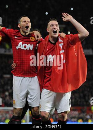 Ryan Giggs of Manchester United and Phil Jones of Manchester United celebrates winning the during the Barclays Premier League match between Manchester United and Aston Villa in Old Trafford Stadium on April 22, 2013. Stock Photo