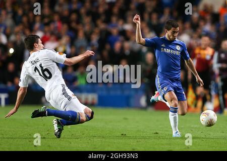 Eden Hazard of Chelsea is tackled by FC Basel's Fabian Schar during the Europa League Semi Final, Second Leg match between Chelsea and Basel in Stamford Bridge, London, United Kingdom on May 2, 2013. Stock Photo