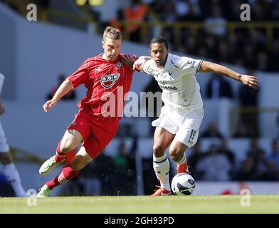 Tottenham's Moussa Dembele tussles with Southampton's Rickie Lambert during the Barclays Premier League match between Tottenham Hotspur and Southampton in White Hart Lane, London on April 21, 2013. Picture David Klein Stock Photo