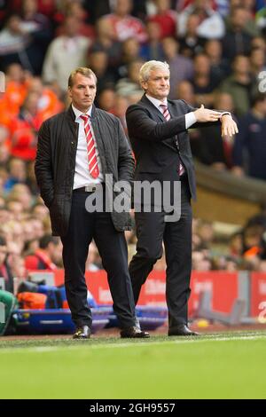Manager of Liverpool, Brendan Rodgers and Stoke's manager, Mark Hughes during the Barclays Premier League match between Liverpool and Stoke City at Anfield, Liverpool on August 17, 2013. Phillip Oldham Stock Photo