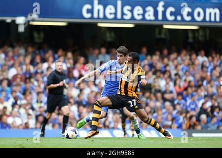 Ahmed Elmohamady of Hull City and Emboaba Oscar of Chelsea battle during the Barclays Premier League match between Chelsea and Hull City Tigers held at the Stamford Bridge in London, UK on Aug. 18, 2013. Photo by:Charlie Forgham-Bailey Stock Photo