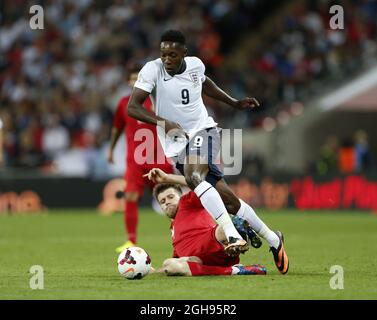 England's Danny Welbeck tussles with Moldova's Simion Bordian during the 2014 FIFA World Cup Qualifier, Group H match between England and Moldova at the Wembley Stadium in London on September 6, 2013. Stock Photo