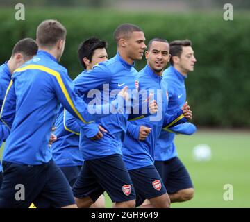 Arsenal's Theo Walcott and Kieran Gibbs during a training session on the UEFA Champions League match at London Colney in London, England on September 17, 2013. David Klein Stock Photo