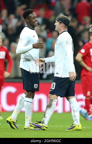 England's Danny Welbeck congratulates England's Wayne Rooney after the match during their FIFA World Cup 2014 qualifier soccer match between England and Poland at the Wembley in London, England, Oct. 15, 2013. Pic Charlie Forgham Stock Photo