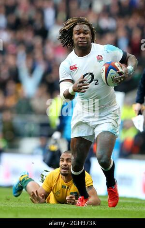 England's Marland Yarde breaks a tackle from Australia's Will Genia during the QBE Autumn International match between England and Australia at Twickenham Stadium in London on November 2, 2013. Stock Photo