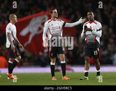 Liverpool's Jordan Henderson and Daniel Sturridge look on dejected at the final whistle during the FA Cup between Arsenal and Liverpool at Emirates Stadium in London, England on February 16, 2014. David KleinLandov Stock Photo