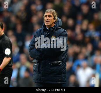 Manuel Pellegrini manager of Manchester City looks on during the Barclays Premier League match between Manchester City and Aston Villa held at Etihad Stadium in Manchester, United Kingdom on May 07, 2014. Stock Photo