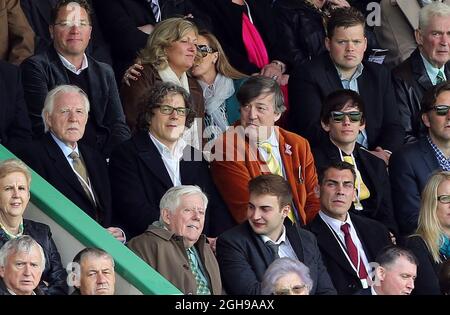 QI presenter Stephen Fry with panellist Alan Davies and Elliott Spencer (far right) in Barclays Premier League match between Norwich City and Arsenal at The Carrow Road in Norwich, United Kingdom on May 11, 2014. Stock Photo