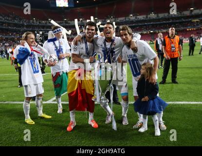 Real Madrid's Pepe, Cristiano Ronaldo and Daniel Carvajal celebrate with the trophy during the UEFA Champions League soccer final match between Real Madrid and Atletico Madrid at Estadio da Luz Stadium in Lisbon, Portugal on May 24, 2014. Pictured by David Klein/Sportimage. Stock Photo
